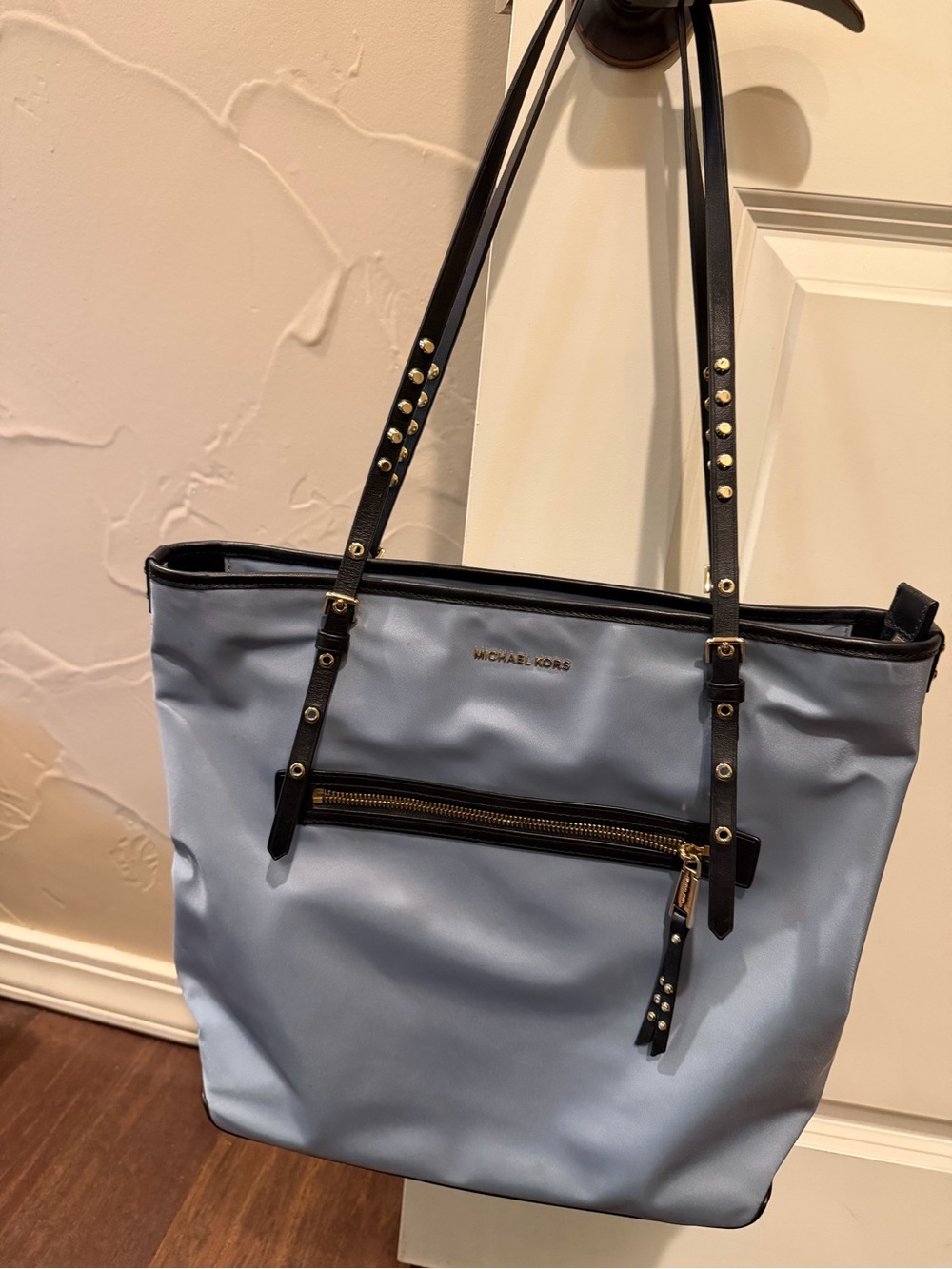 Michael Kors Light Blue Zip Tote Bag with Black Trim.